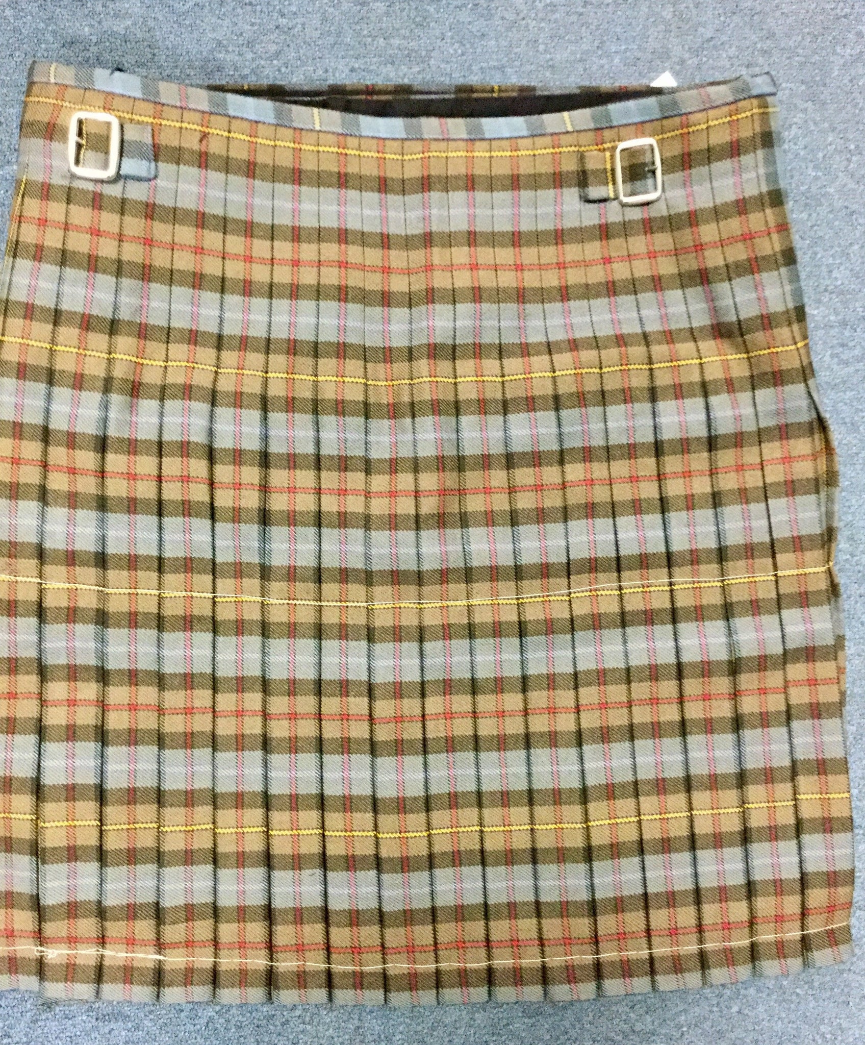 Box Pleat kilt pleated to the red stripe.