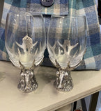 Wine glasses sitting on solid pewter stag base